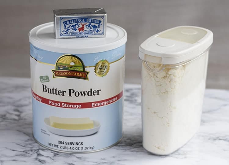 Containers of butter powder on counter.