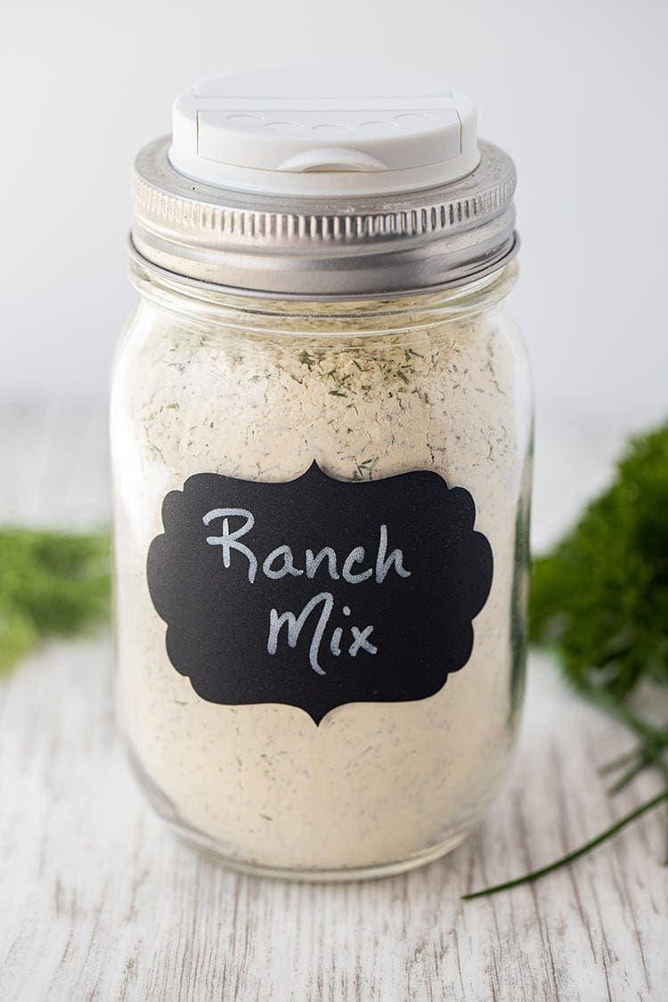 Dry Ranch Seasoning Mix in a pint-size mason jar with a black chalkboard label on front that says "Ranch Mix".