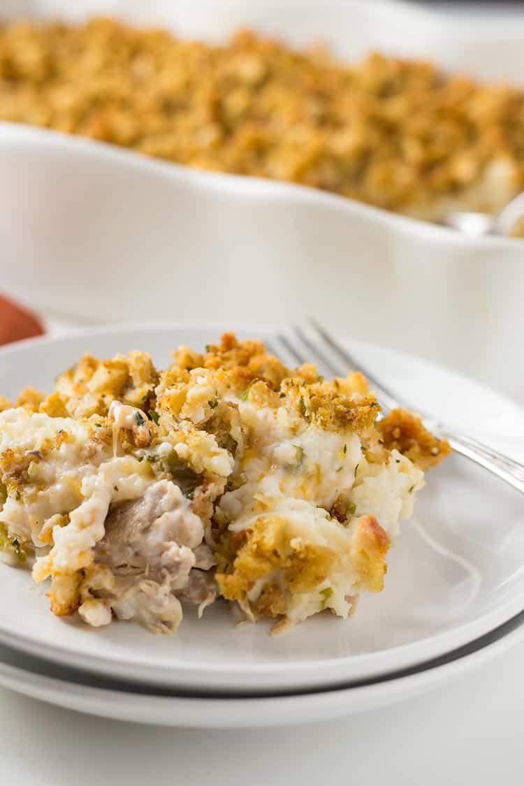 Thanksgiving Casserole on plate with cheesy layer showing