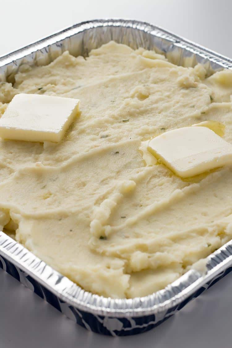 Garlic Herb Mashed Potatoes in aluminum pan for freezing