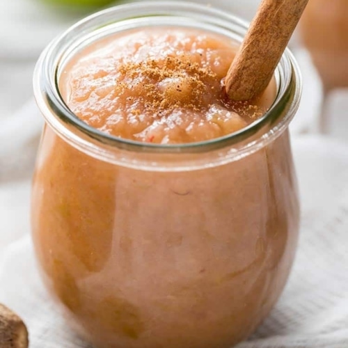 Easy Instant Pot Applesauce in a small jar with cinnamon stick