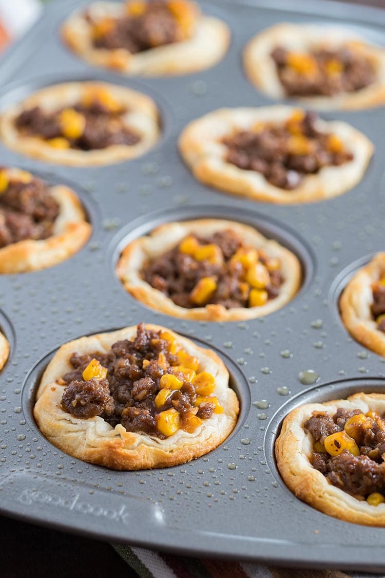 Beefy Barbecue Biscuit Cups cooked in muffin tin, ready to freeze
